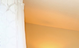 Yellow, brown and white color scheme in master bedroom at Summit Pointe in Oklahoma City, OK